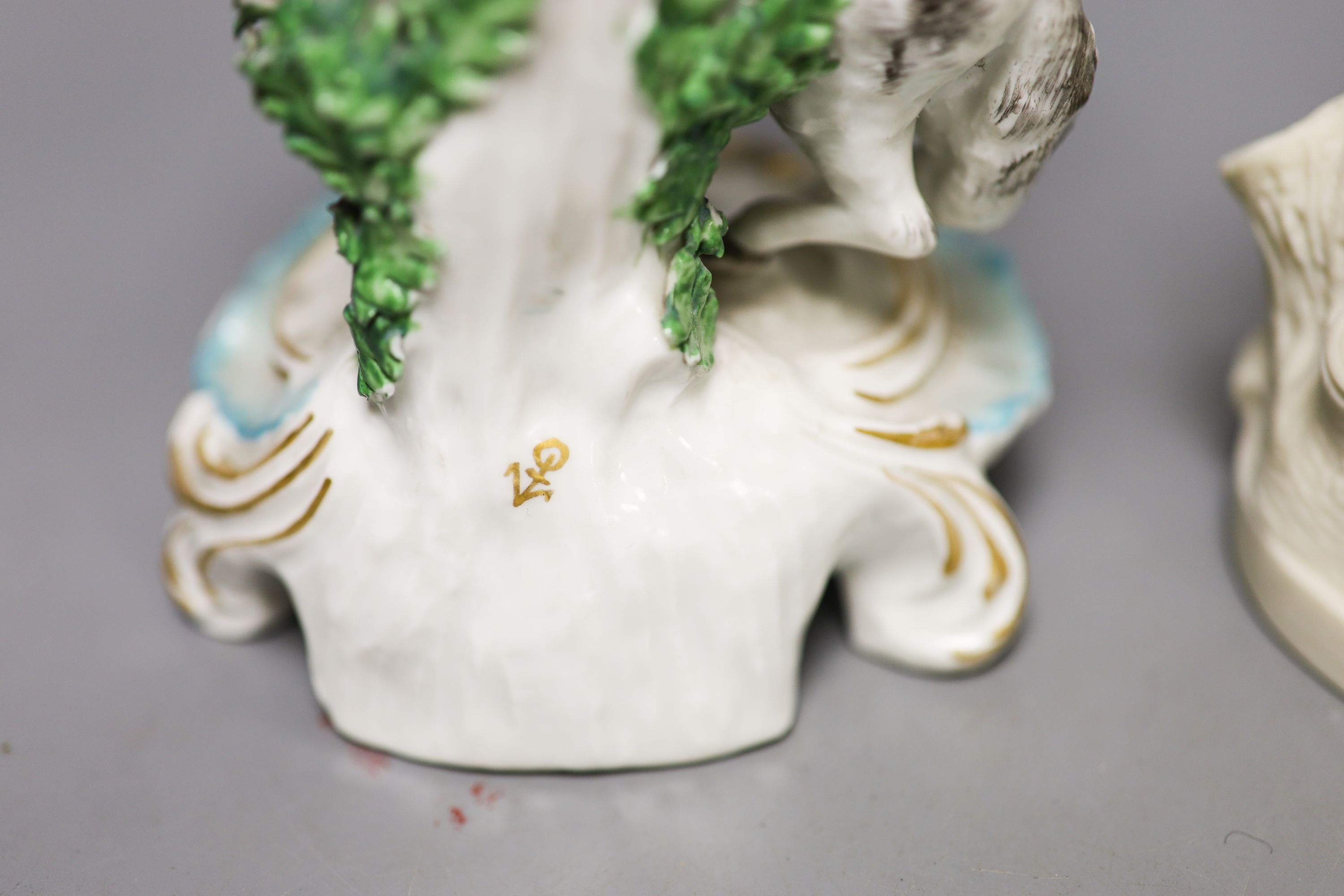 A Samuel Alcock parian group of a maid and sheep, a similar Minton biscuit group and a Samson porcelain group in Derby style Tallest 27cm